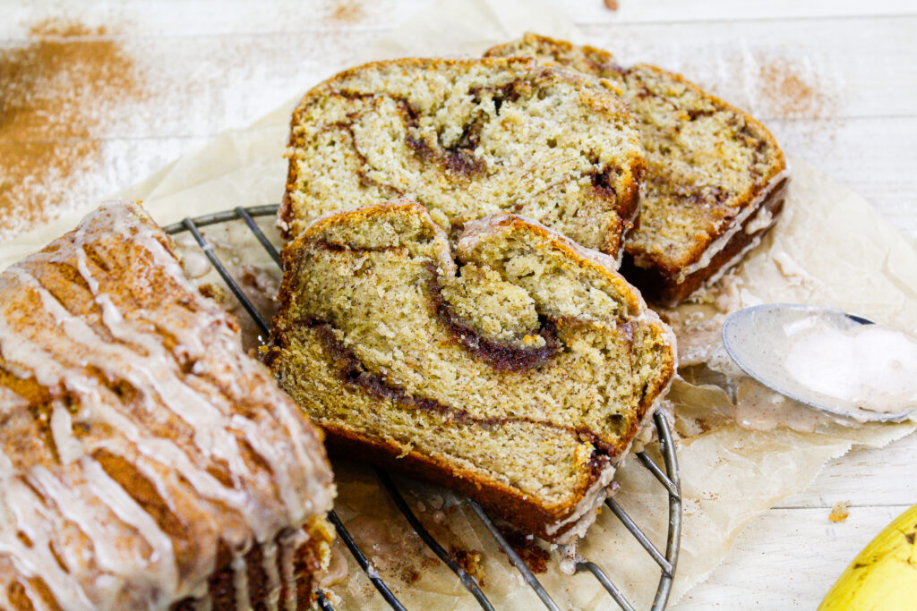 image of slices of cinnamon swirl banana bread showing the ribbons of cinnamon sugar in each slice