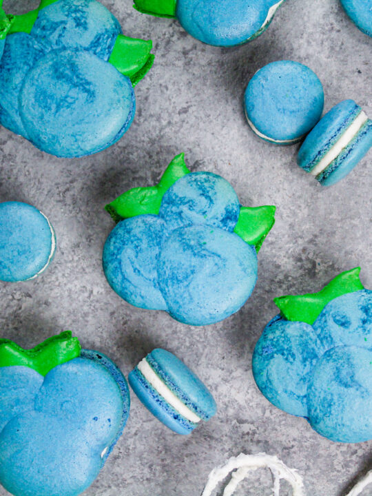 image of blueberry shaped macarons baked and filled with buttercream and blueberry jam