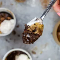 image of a protein mug cake topped with peanut butter and whipped cream