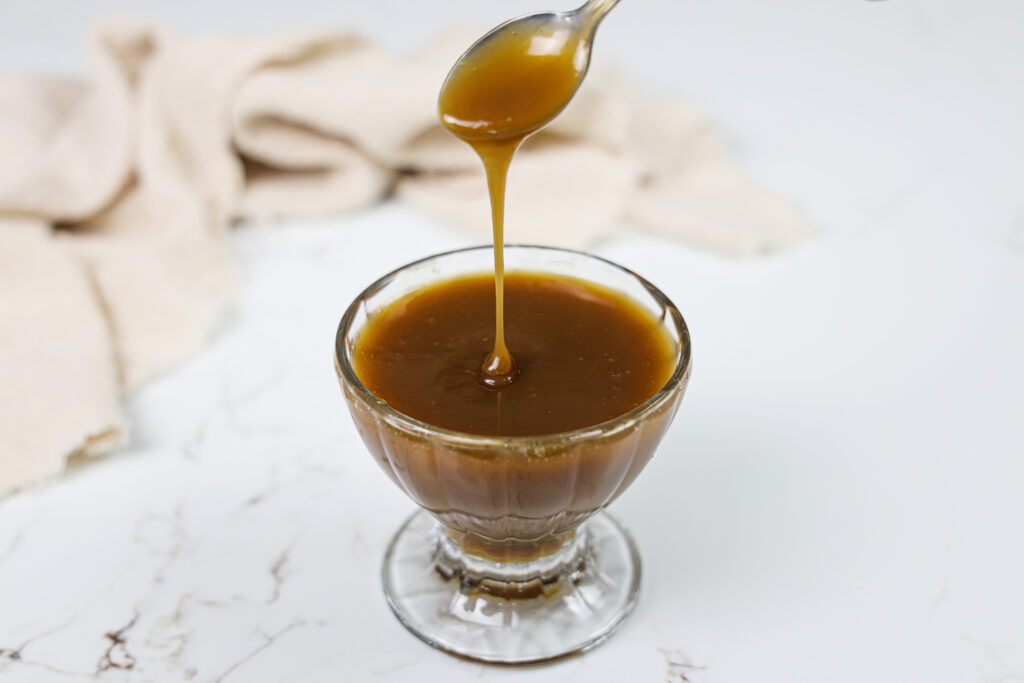image of vegan condensed milk made with coconut milk and turbinado sugar horiz