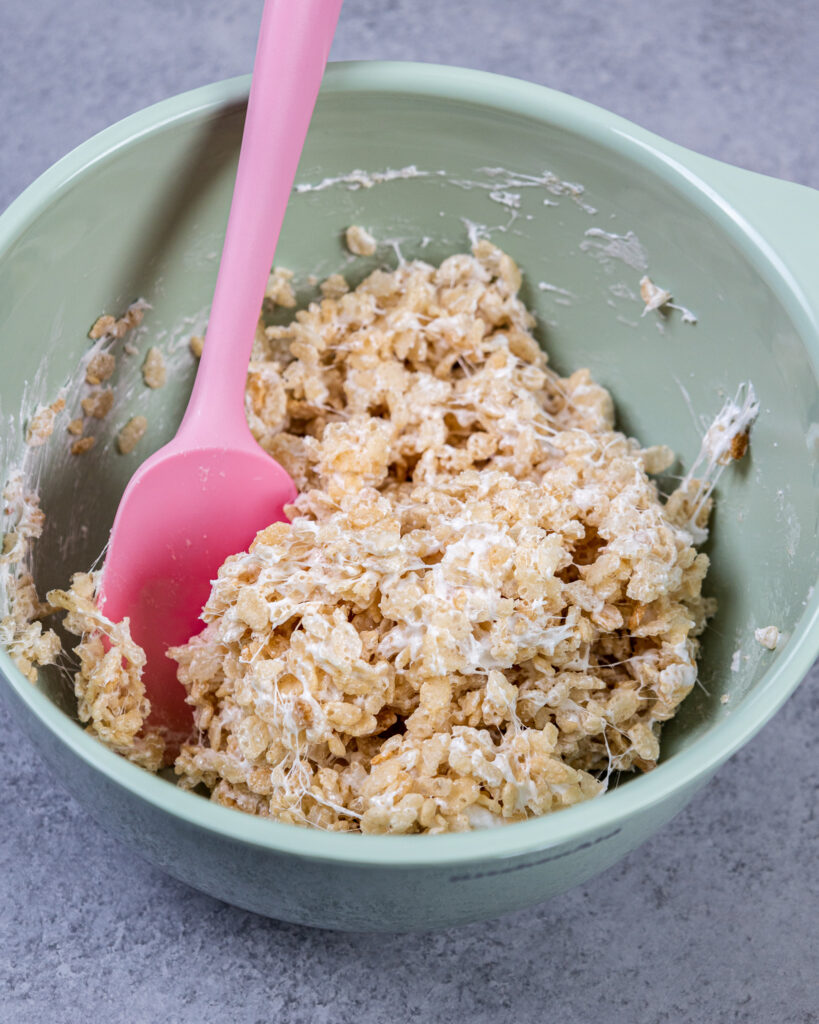image of cake decorating rice krispie treats made to create the hat on a gnome cake