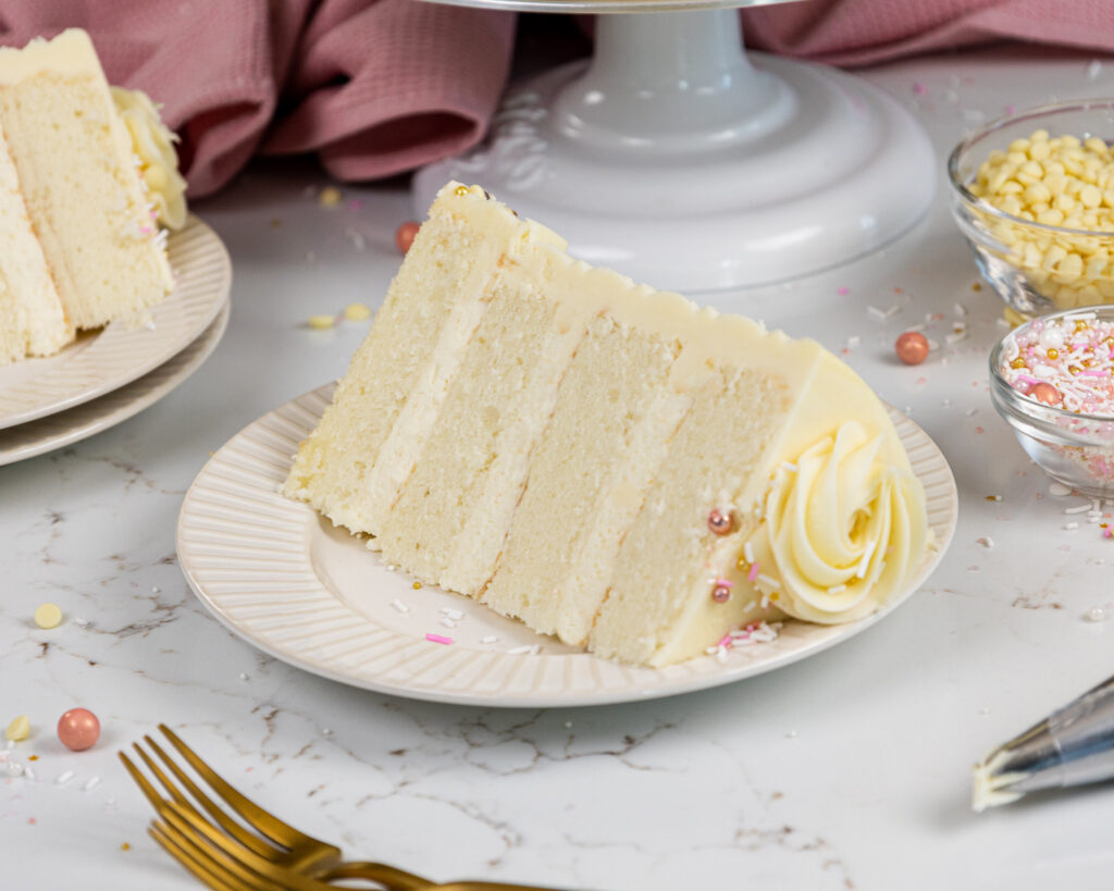 image of a vanilla cake that's filled with a white chocolate mousse cake filling