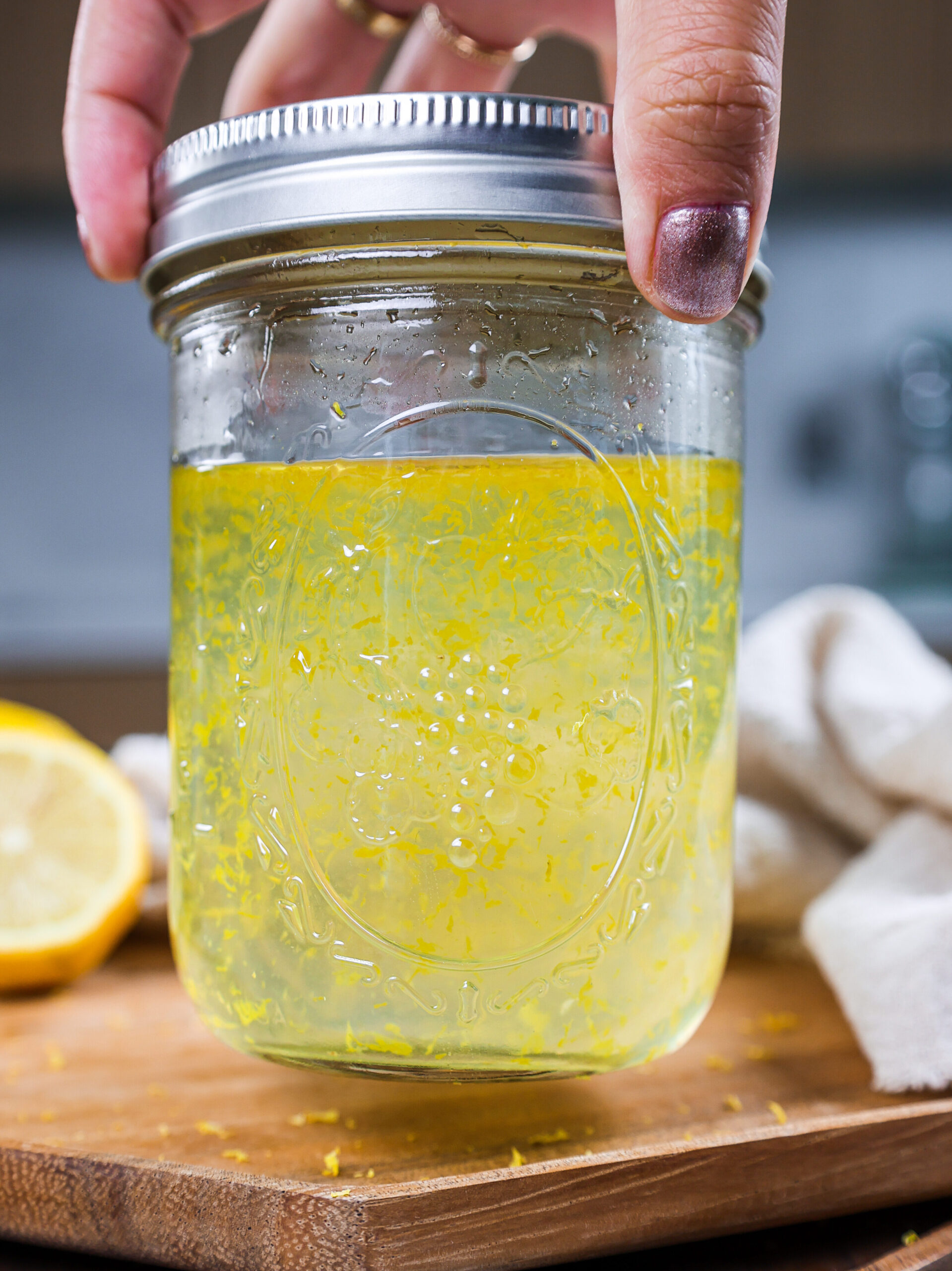 image of lemon simple syrup stored in a mason jar for easy storage