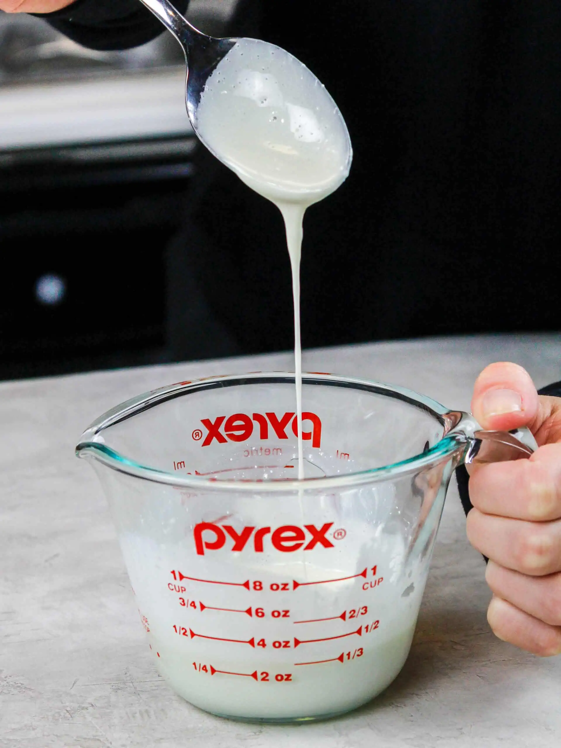 image of a bright white mirror glaze made with titanium dioxide