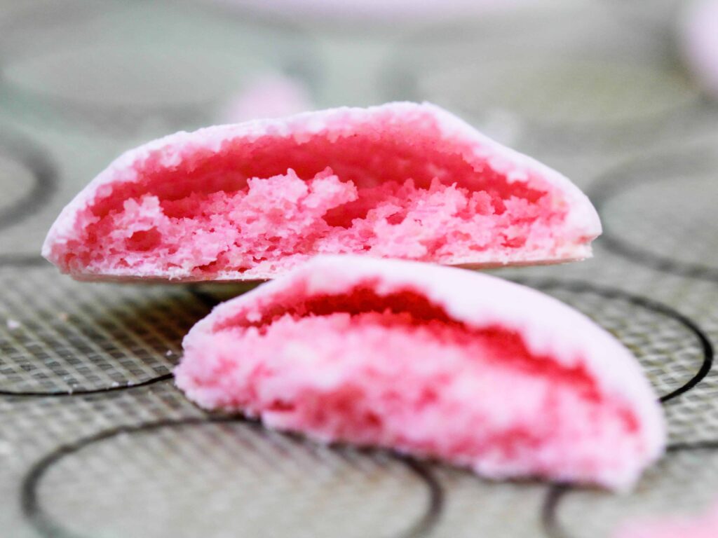 image of macaron shells that have baked up with hollow shells because they were underbaked