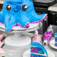 image of an octopus cake made with colorful cake layers and homemade buttercream