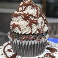 image of oreo cupcake drizzled with chocolate ganache