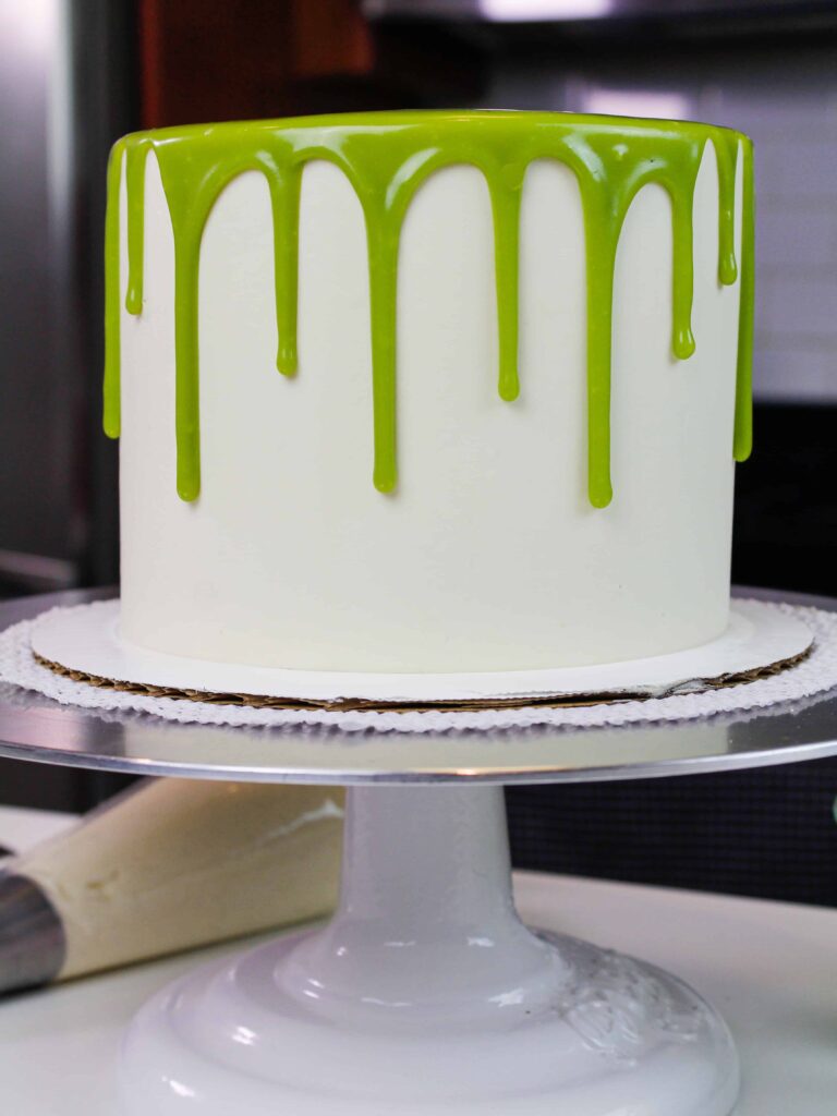 photo of a matcha cake decorated with green matcha drips