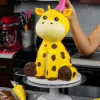 image of a giraffe cake made with buttercream and rice krispies