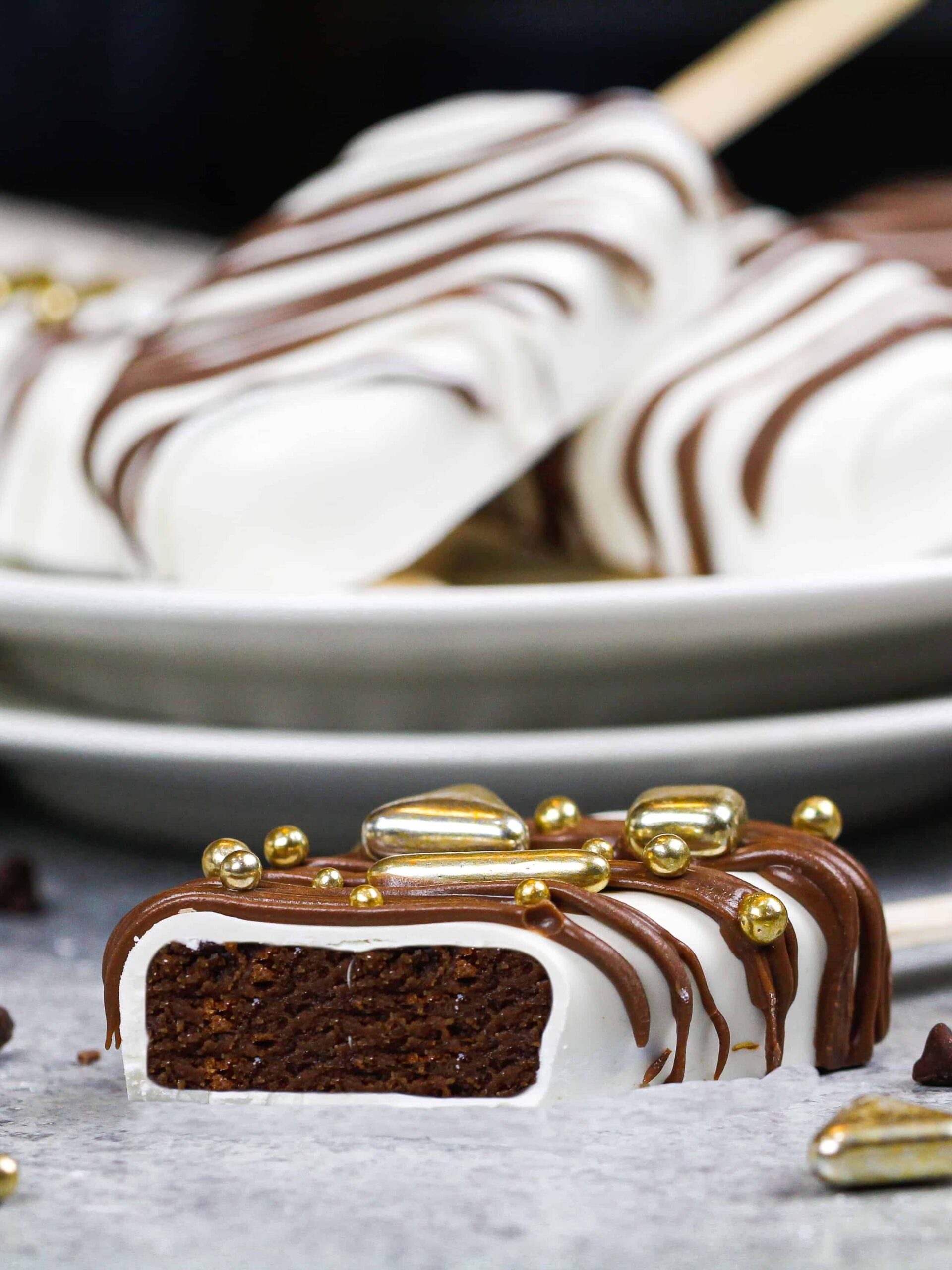 image of cut into chocolate and white chocolate cakesicle