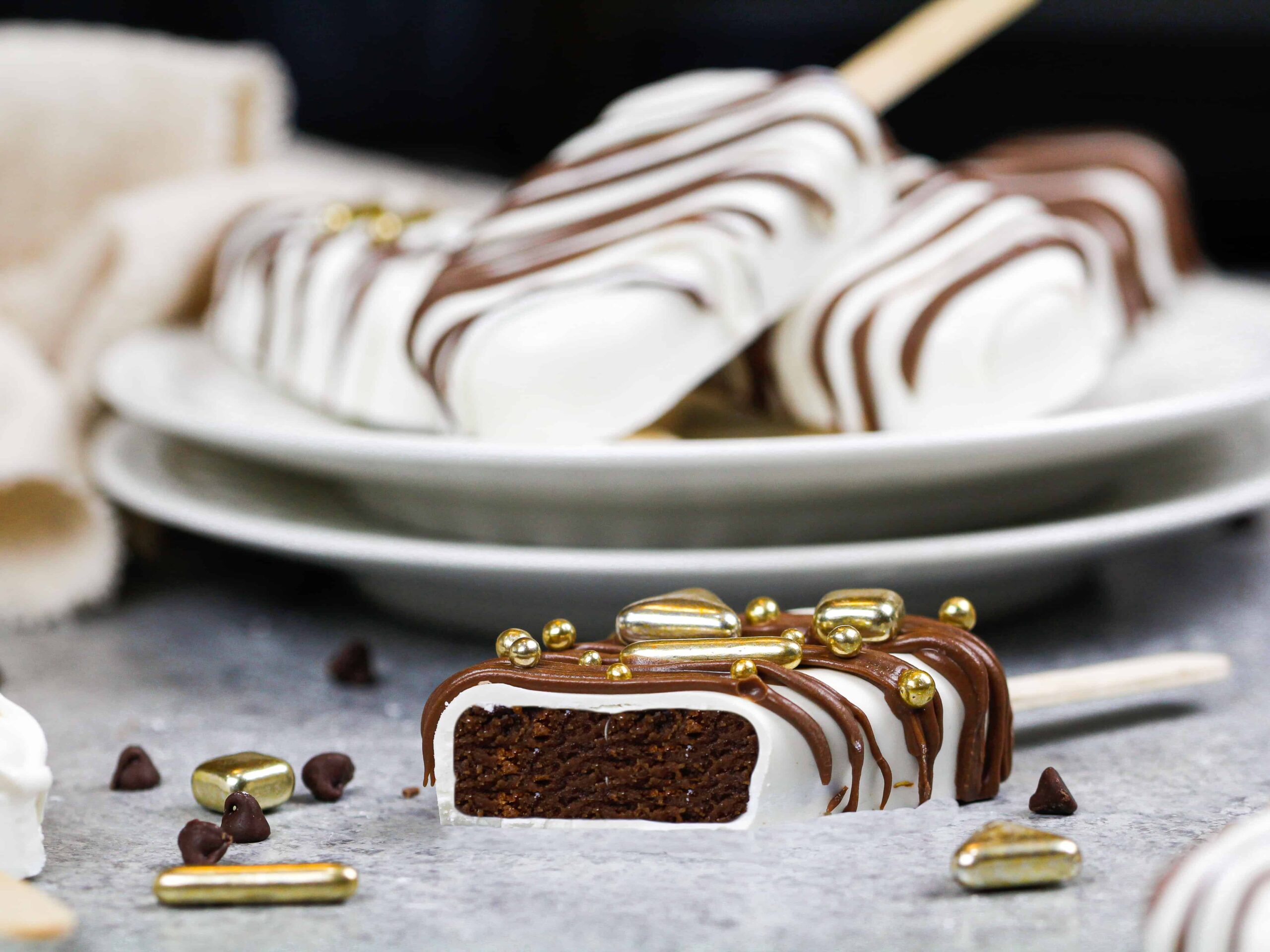image of cut into chocolate and white chocolate cakesicle
