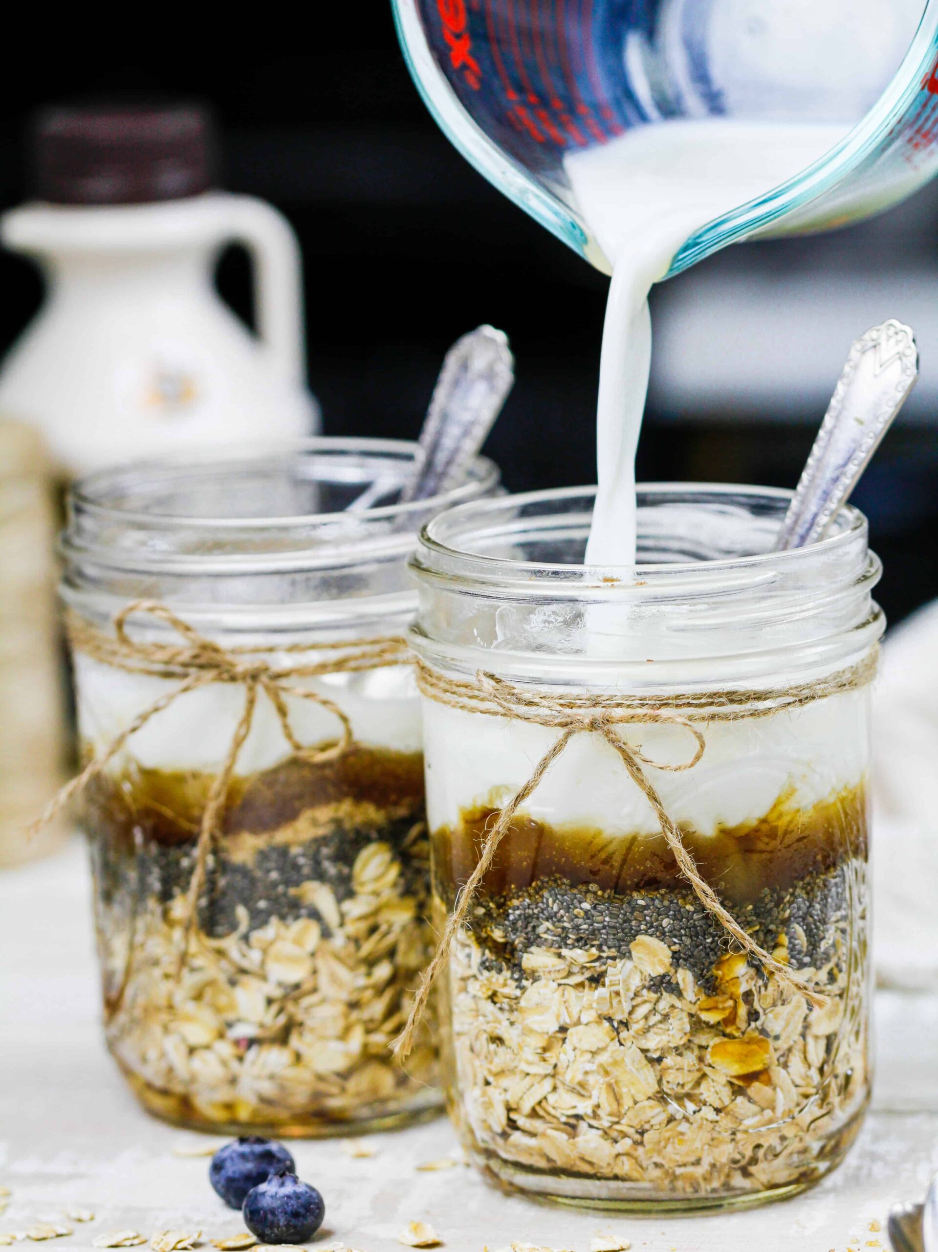 image of ingredients in a mason jar to make maple overnight oats