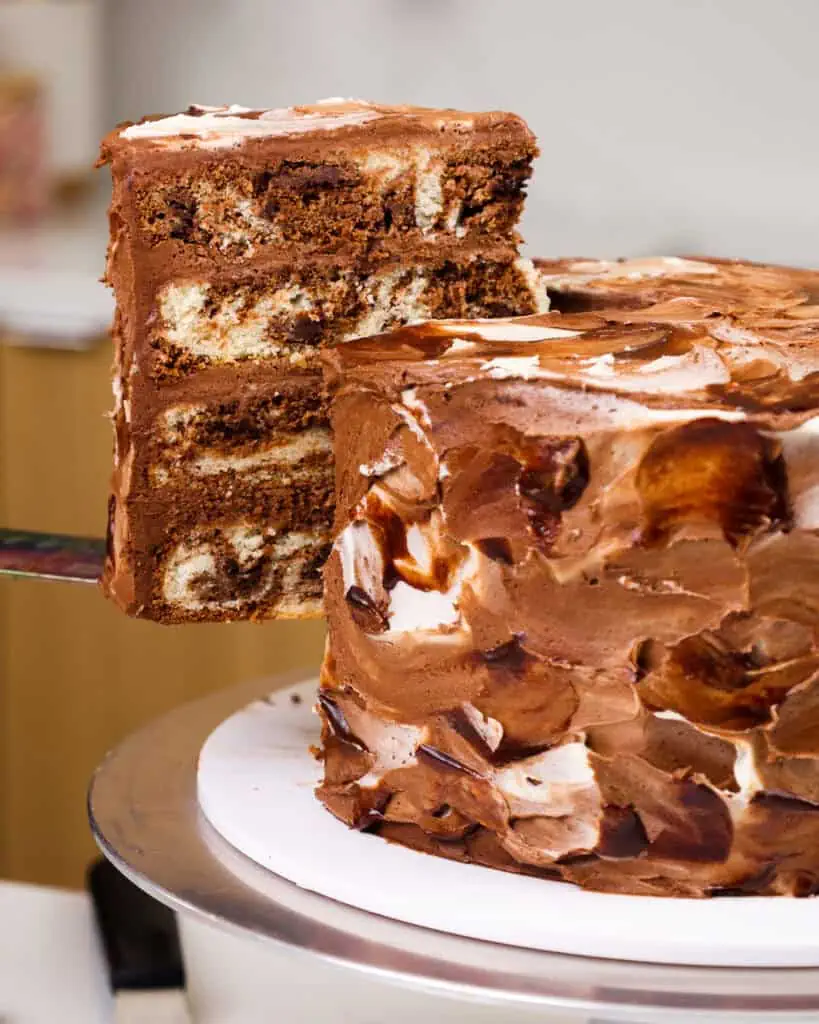 image of a slice of layered marble cake being cut and plated