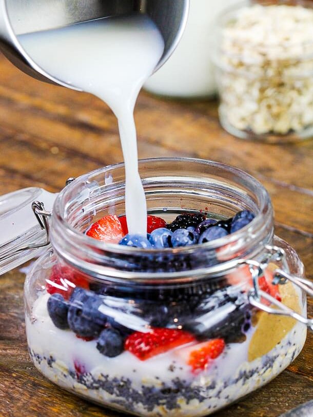 image of milk being poured into overnight oats
