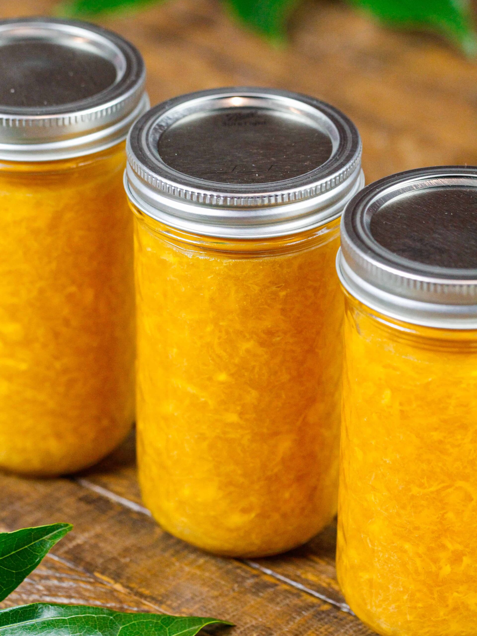 image of homemade mango jam made in a pretty mason jar
