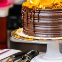 image of orange chocolate cake decorated with a chocolate drip