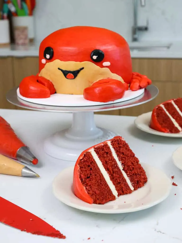 image of a cute crab birthday cake made with buttercream and red velvet cake layers