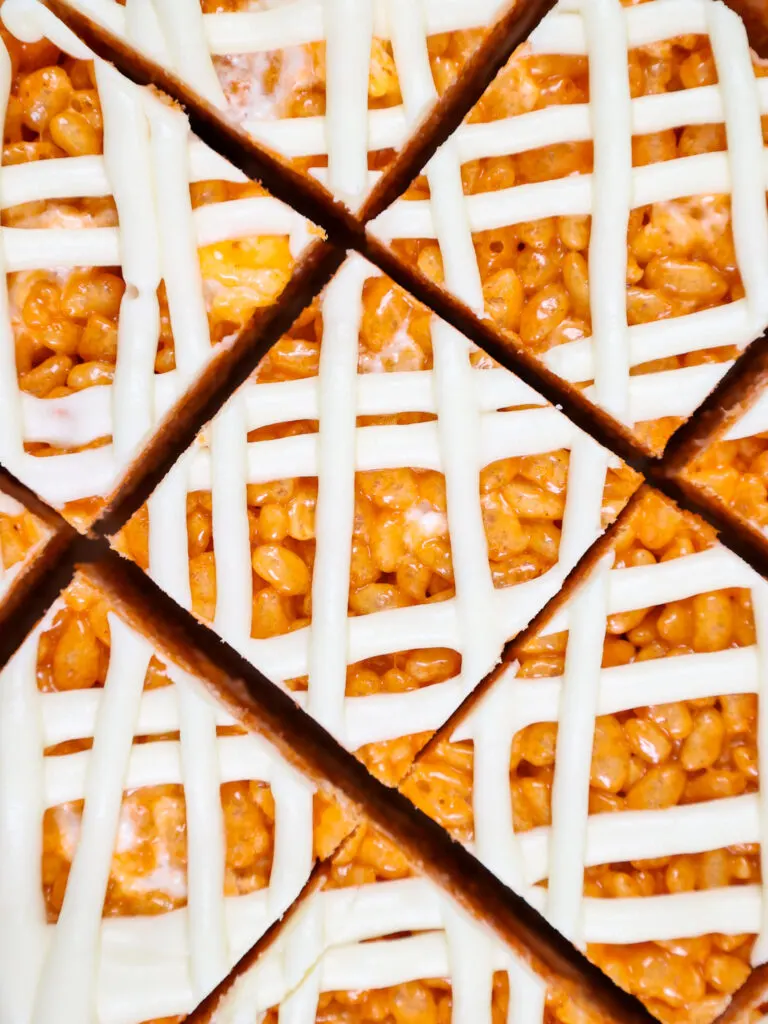 image of pumpkin spice rice krispie treats that have been topped with cream cheese frosting