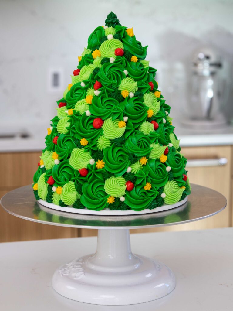 image of a cute buttercream Christmas tree cake