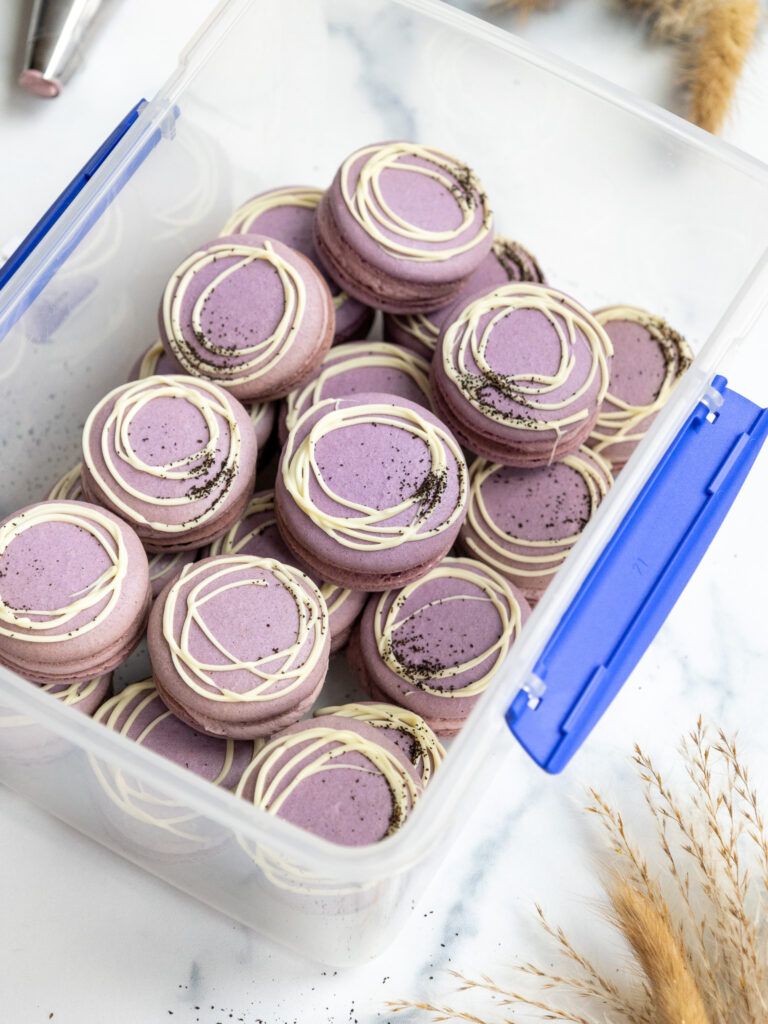 image of earl grey macarons in an airtight container