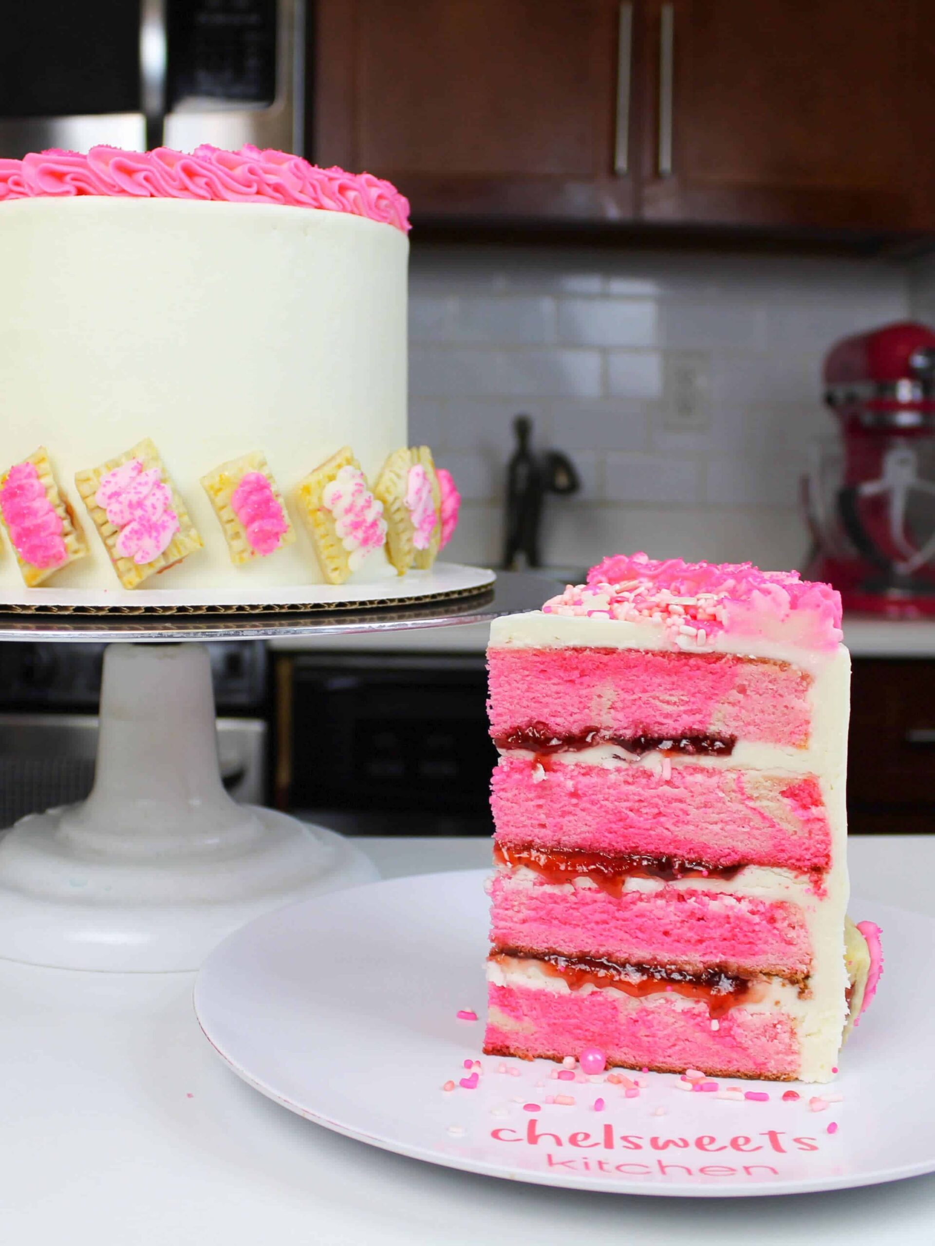 image of a cute strawberry poptart cake that's filled with strawberry jam and decorated with mini strawberry poptarts
