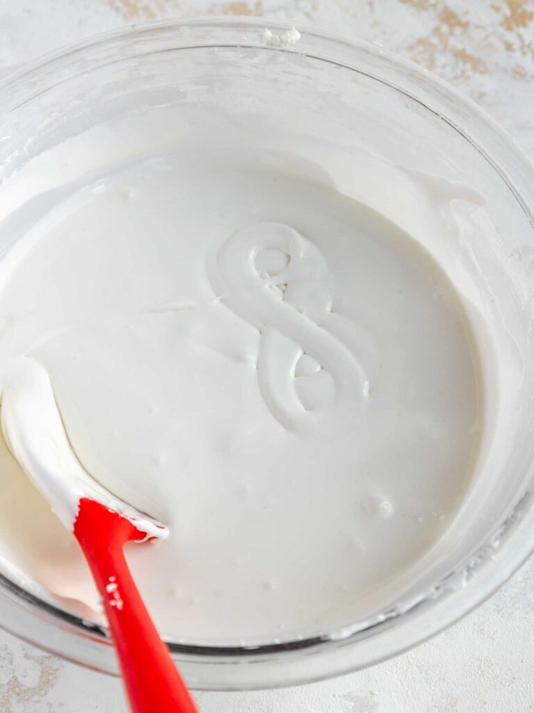 image of royal icing that's been thinned to a flooding consistency and has passed the figure 8 test