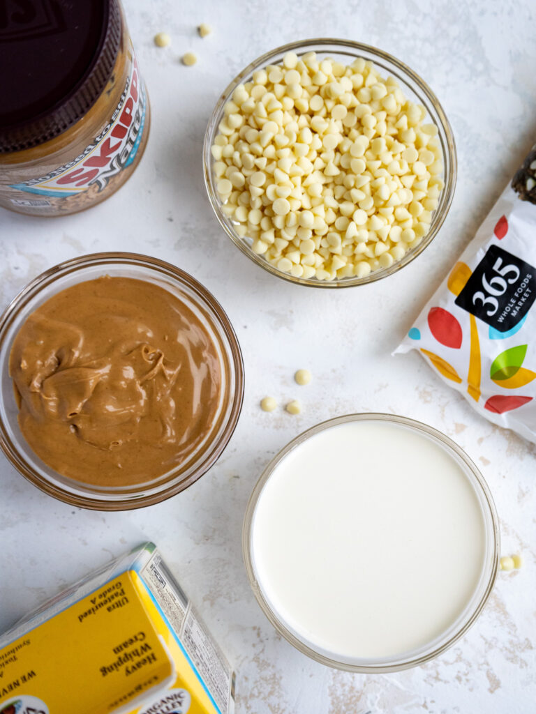 white chocolate, peanut butter, and heavy cream measured out in small glass bowls