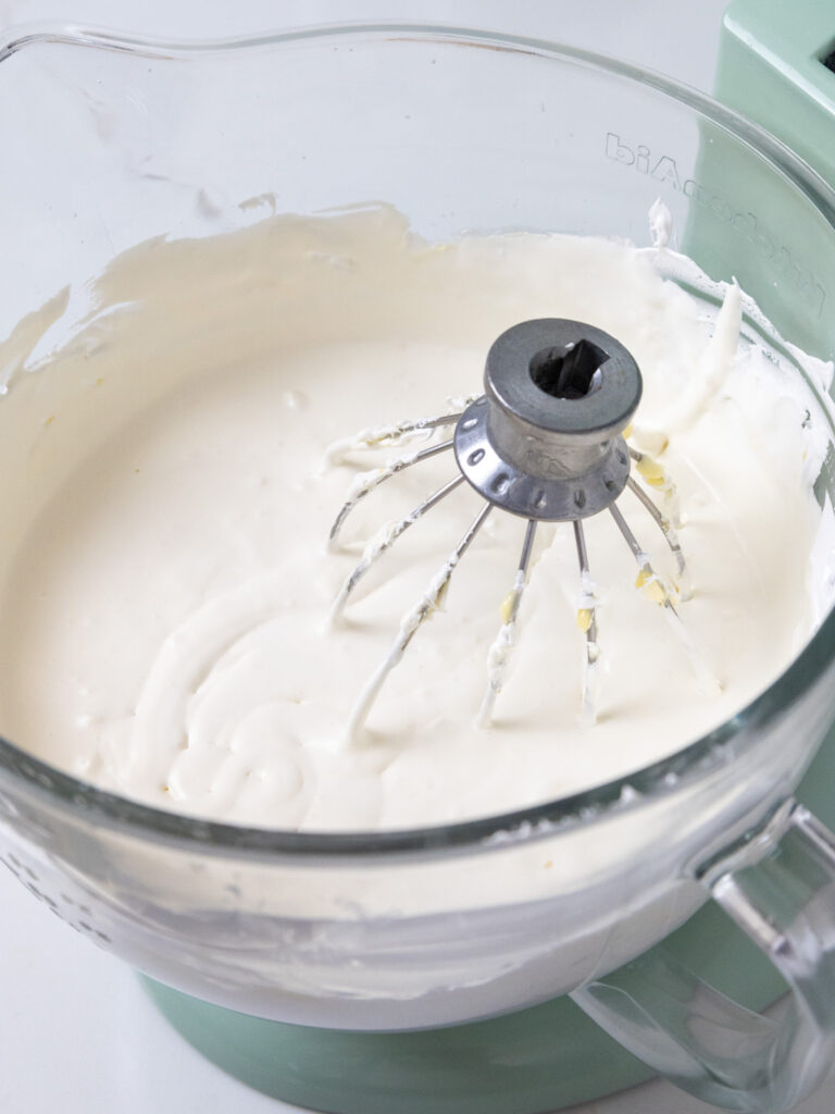image of soupy white chocolate Swiss meringue buttercream that got too warm and lost its shape