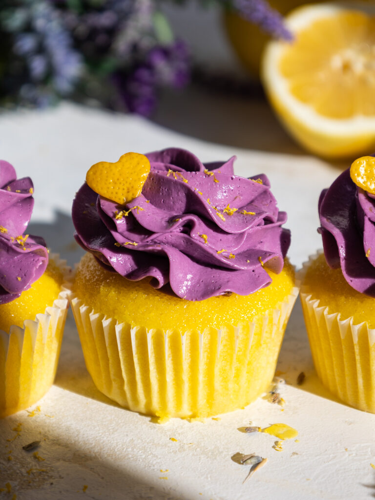 image of lavender lemon cupcakes that are garnished with cute lemon peel hearts