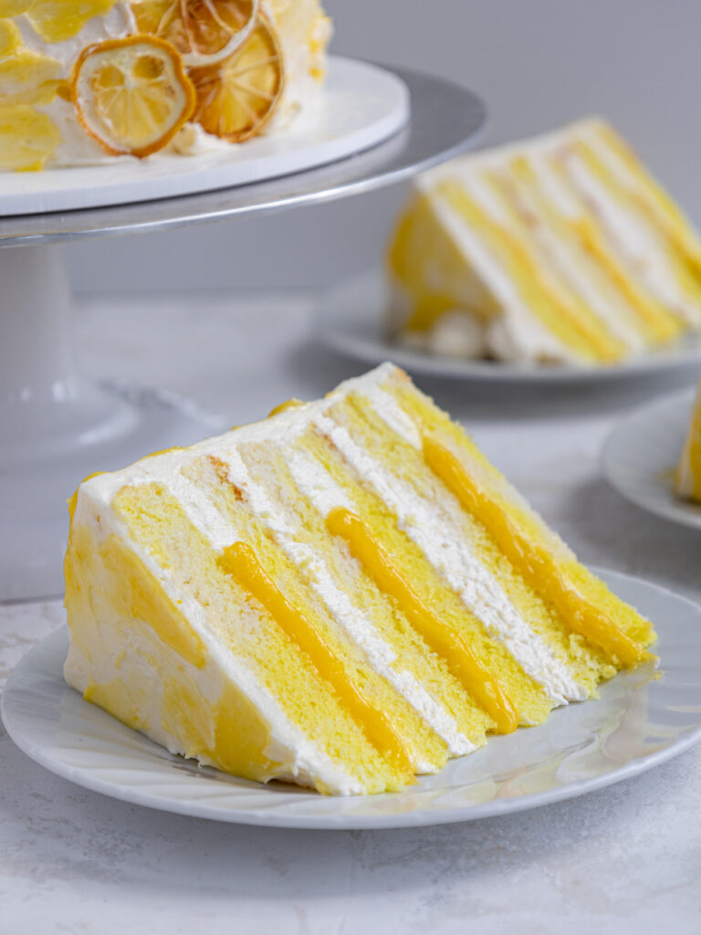 image of a slice of lemon curd cake on a plate