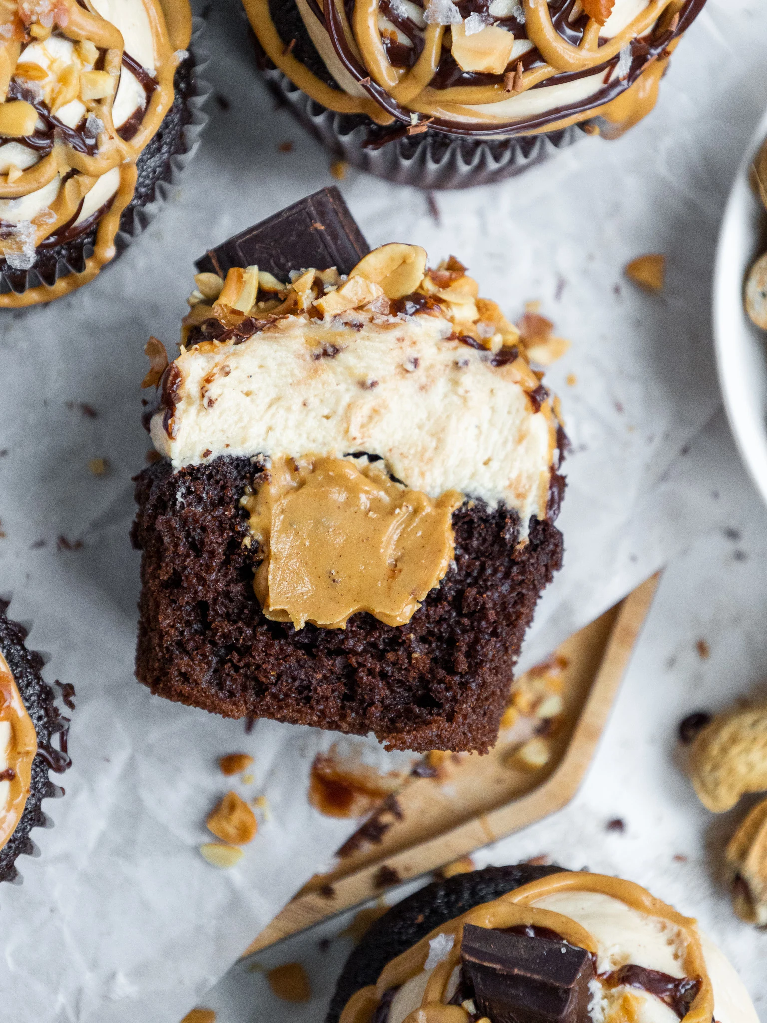 image of a peanut butter filled cupcake that's been cut into to show it's filling
