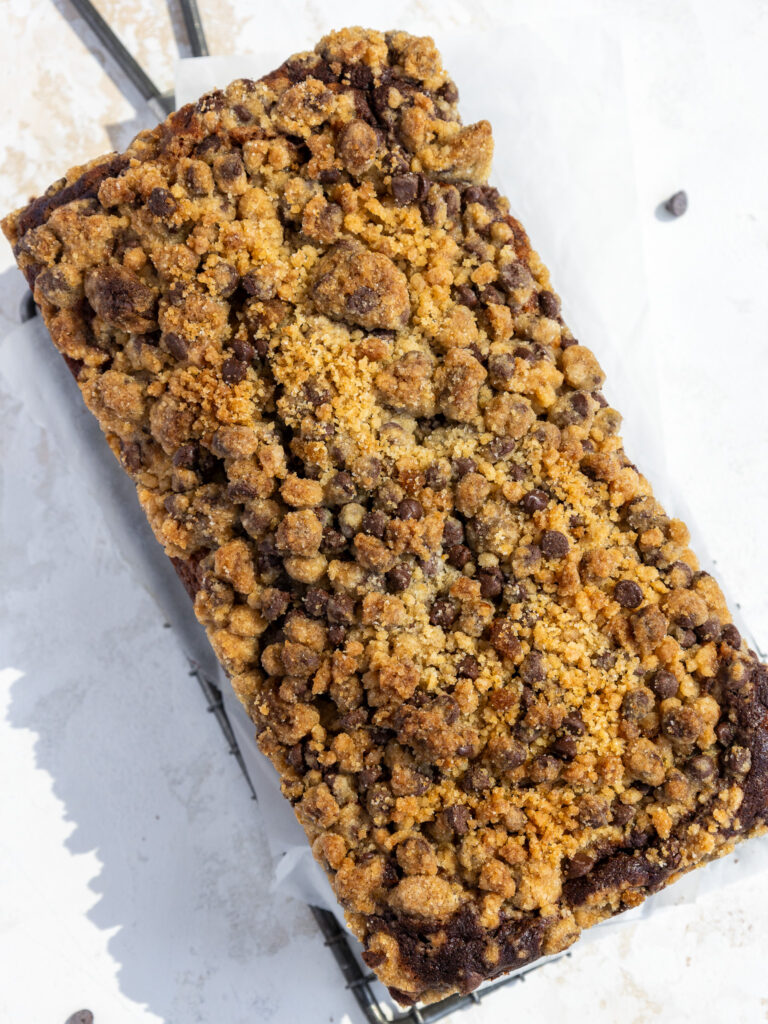 image of marble banana bread loaf that's been baked until the streusel is golden brown