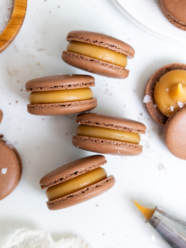 image of caramel macarons being stacked