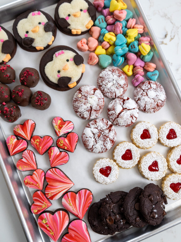 image of Valentine's Day cookies laid out on a large baking sheet