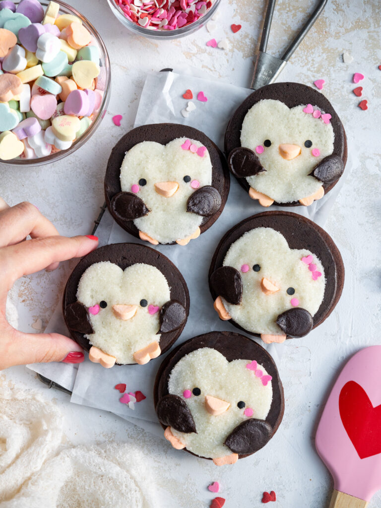 image of cute penguin cookies that have been decorated with buttercream frosting