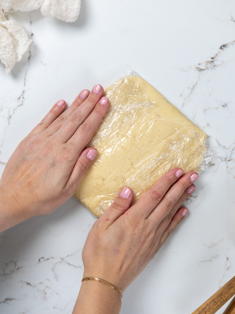 image of cream cheese cookie dough wrapped up in plastic wrap