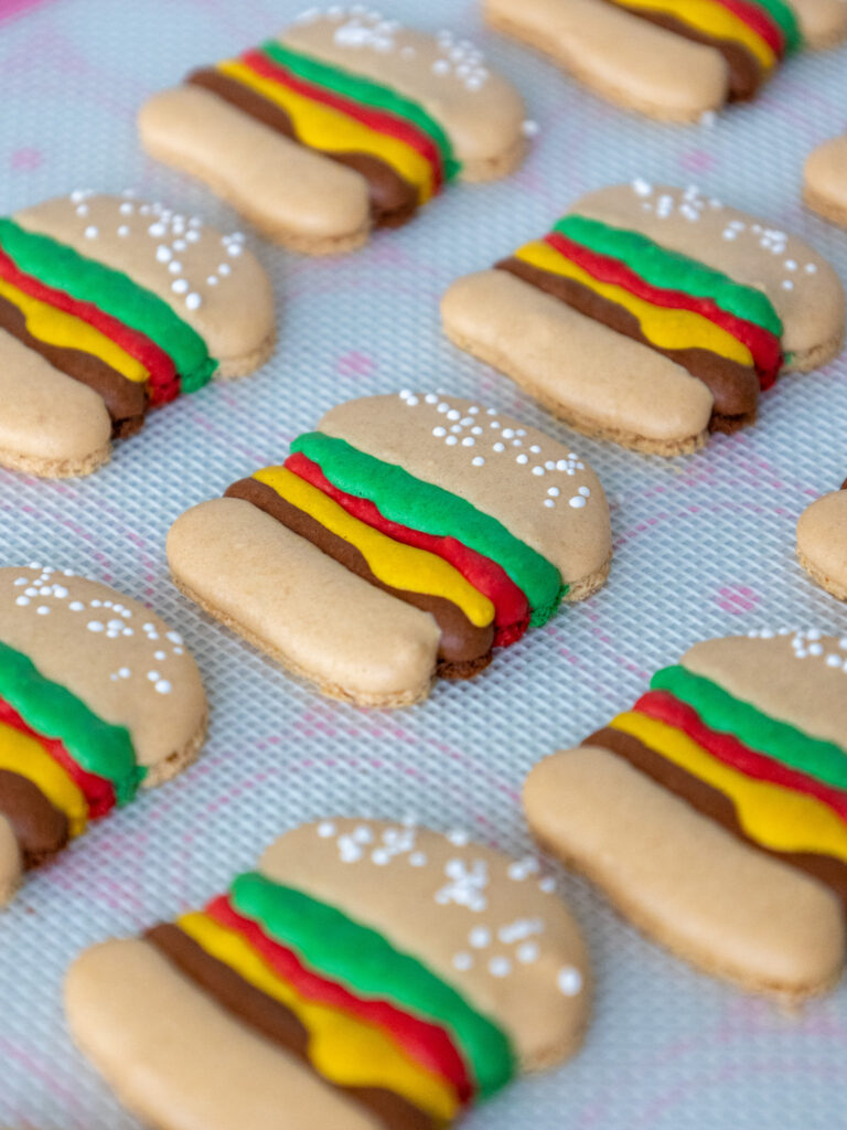 image of baked burger macaron shells