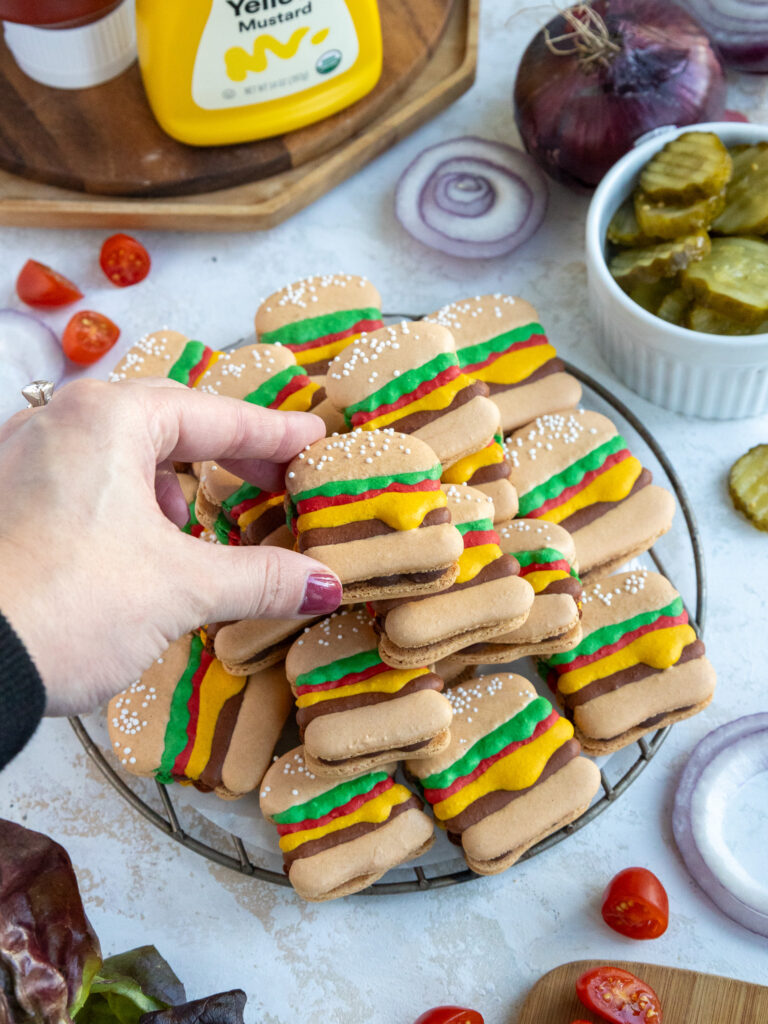 image of burger macarons stacked up in a pile