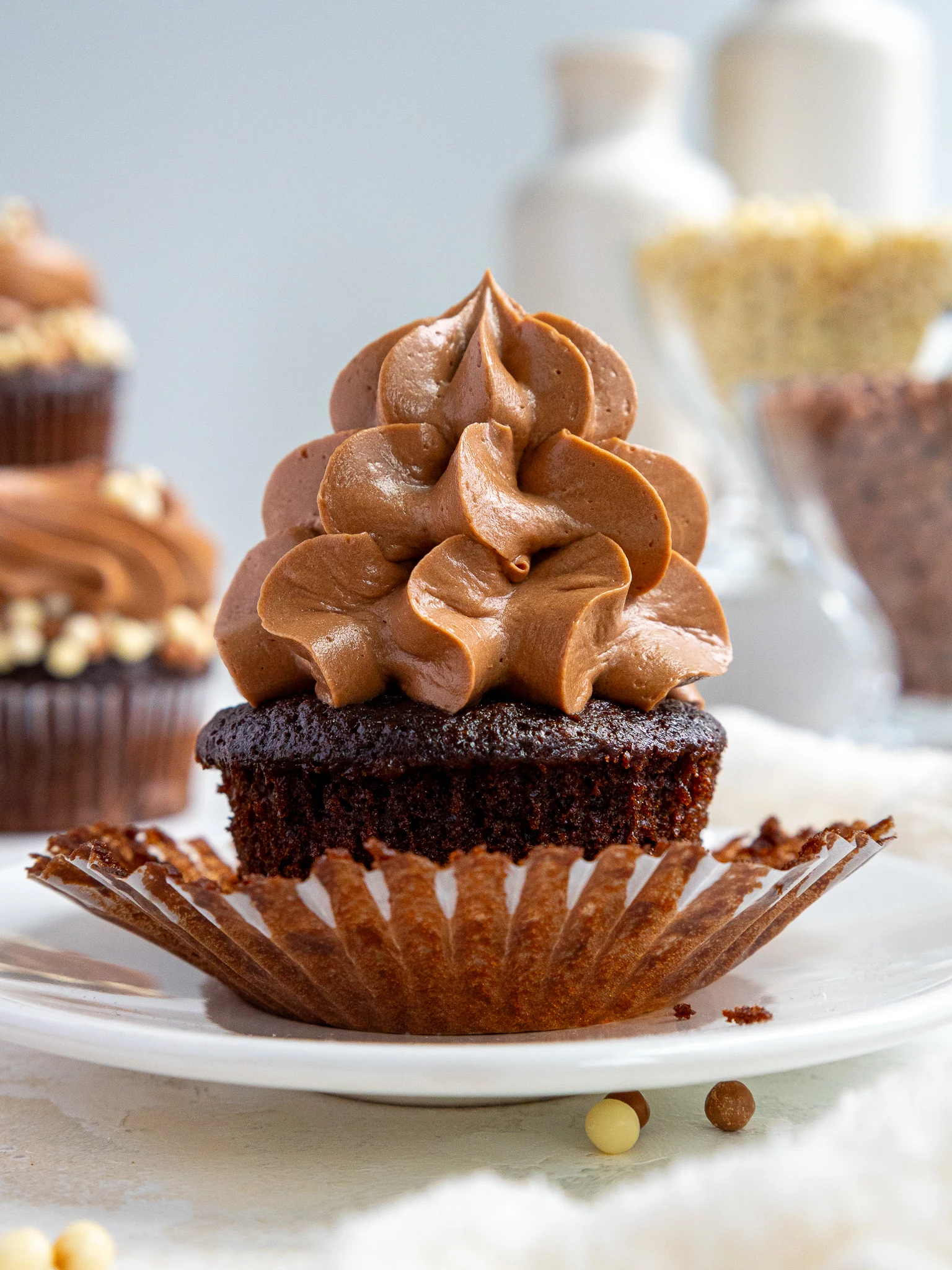 image of a chocolate cupcake frosted with not too sweet chocolate frosting