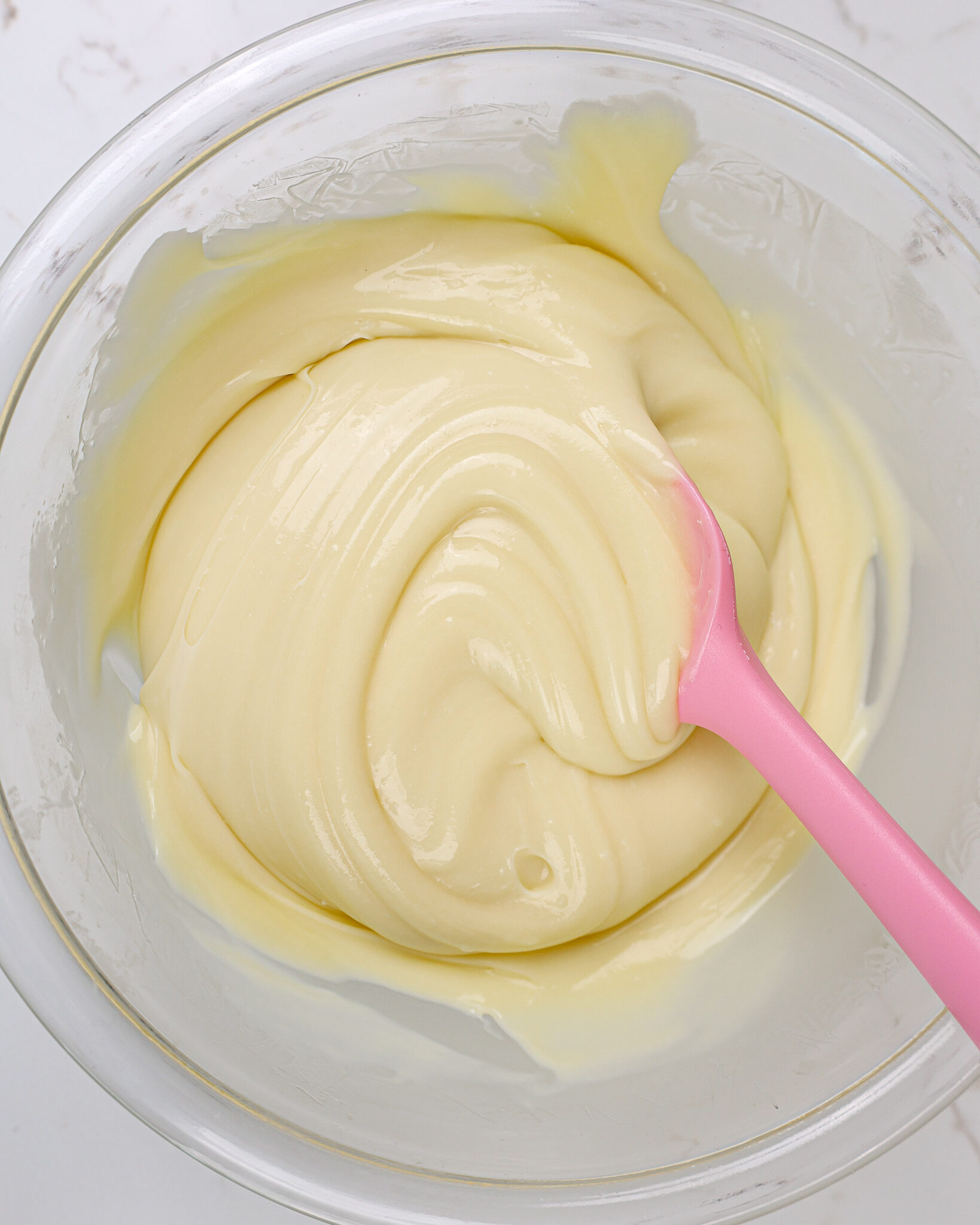 image of white chocolate ganache that' been chilled and is ready to be used to fill macarons
