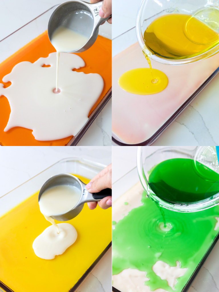 image of jello being poured into a 9x13 inch glass dish to make a rainbow jello cake