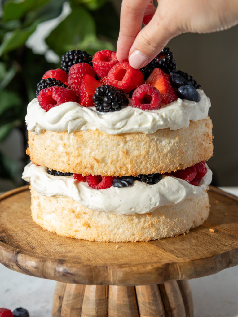 image of a smash cake that's been made with angel food cake and whipped cream frosting