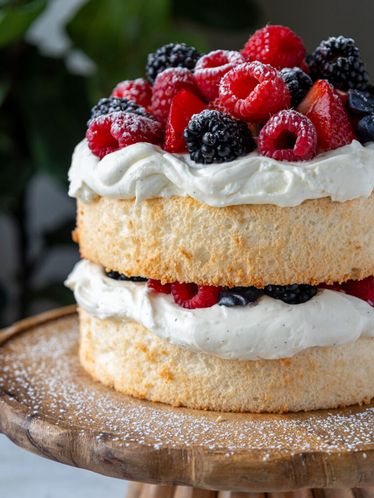 image of a smash cake that's been made with angel food cake and whipped cream frosting