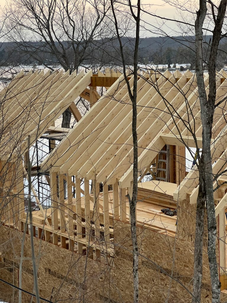 Home under construction, with the wall and roof framing step highlighted