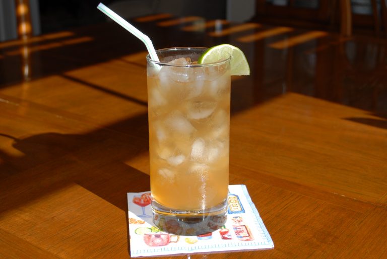 Dark and Stormy made with Dark Rum, Ginger Beer and lime