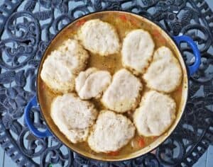 Chicken stew with biscuits on a filigreed table