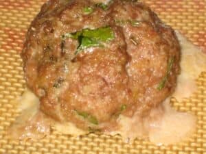 Image shows classic Italian meatball.