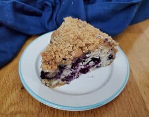 Slices of blueberry streusel coffee cake on a plate.