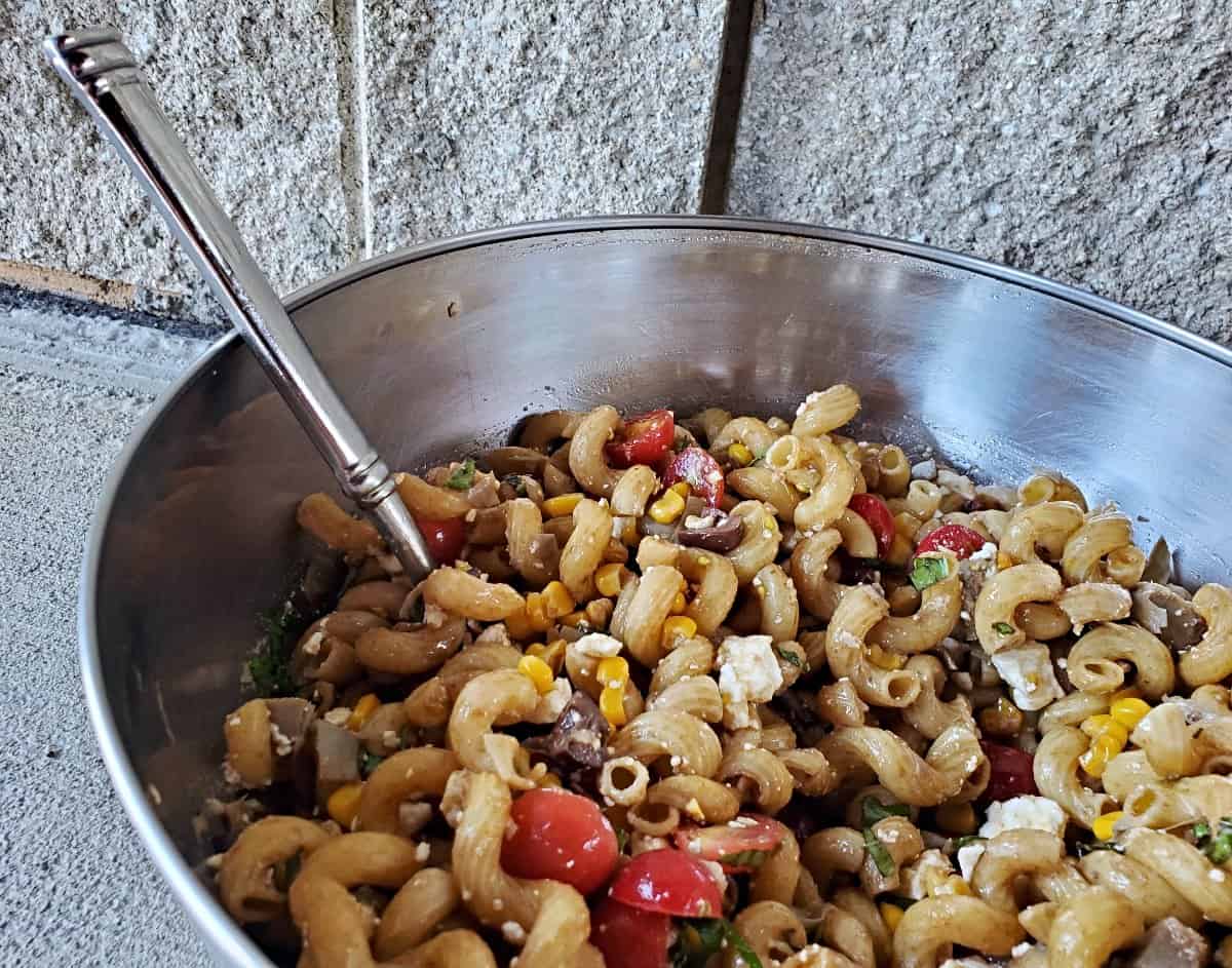 Side close up view of Greek pasta salad.