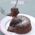 Fork holding a bite of cake with text date night chocolate cake for two.